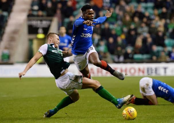 Hibs defender Ryan Porteous tackles Rangers' Lassana Coulibaly. Picture: SNS