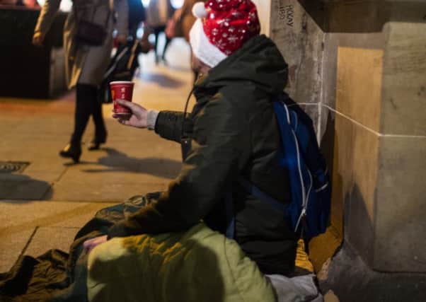 Why not donate warm clothes to help homeless people? Picture: John Devlin