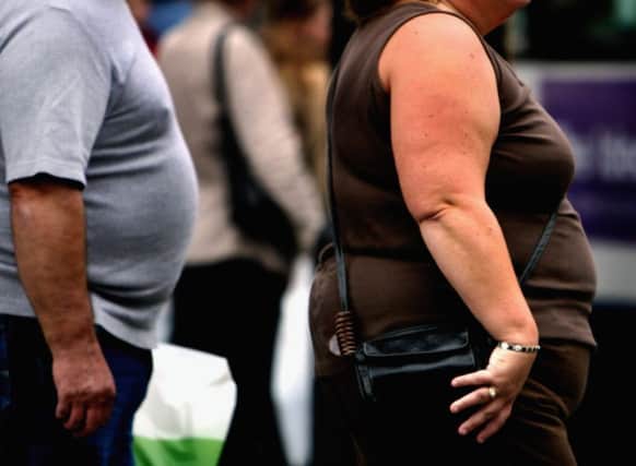 The nation's obesity epidemic has forced mortuaries to install bigger fridges. Picture: Jeff J Mitchell/Getty Images