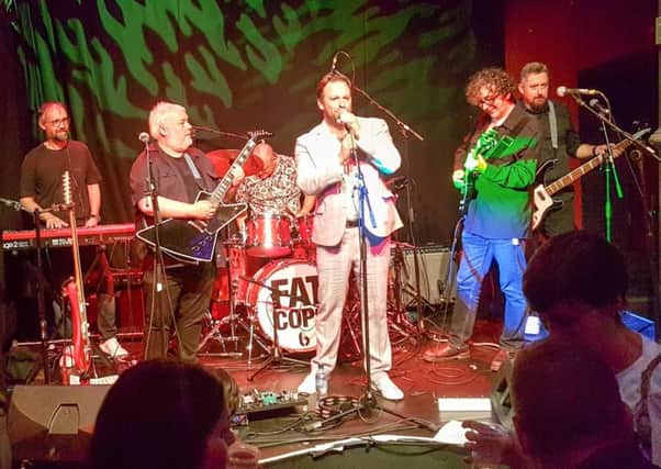 Neil, Euan, Al, Chris, Bobby and Chris performing as Fat Cops, whose album is out in March