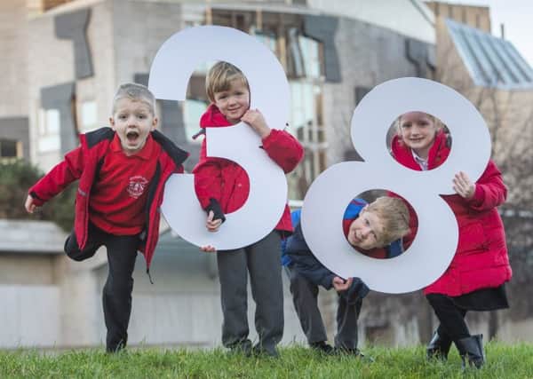 Pupils from Corstorphine Primary School in Edinburgh highlight the number of children made homeless every day. Photograph: Phil Wilkinson
