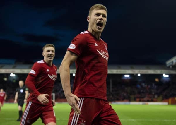 Sam Cosgrove celebrates putting Aberdeen two ahead. Pic: SNS/Ross Parker