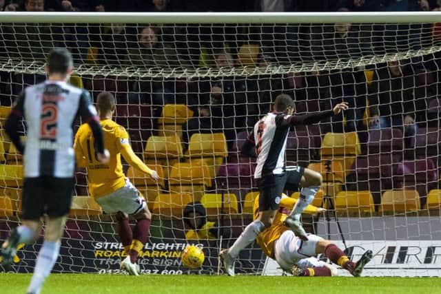 St Mirren's Simeon Jackson scores. Pic: SNS/Alan Harvey