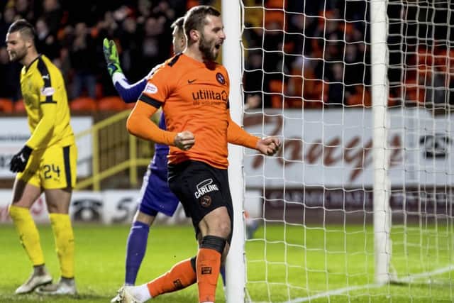 Dundee United's Pavol Sanfranko celebrates doubling the lead. Pic: SNS/Alan Rennie
