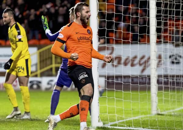 Dundee United's Pavol Sanfranko celebrates doubling the lead. Pic: SNS/Alan Rennie