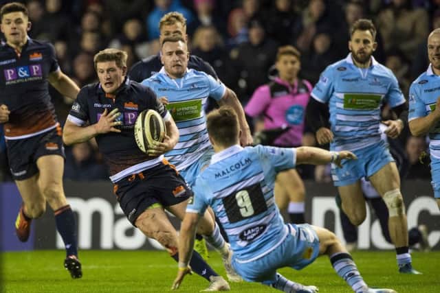 Edinburgh's James Johnstone (left) takes on Glasgow Warriors' George Horne. Pic: SNS/SRU/Bill Murray