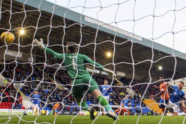 Alfredo Morelos steers a first-time strike beyond Zander Clark to give Rangers all three points. Picture: SNS.