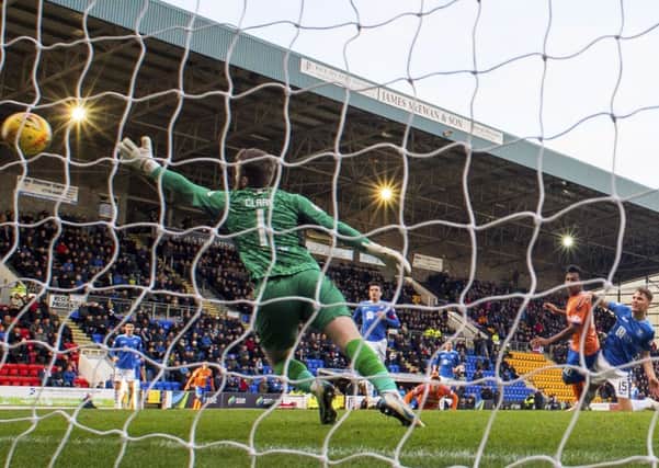 Alfredo Morelos steers a first-time strike beyond Zander Clark to give Rangers all three points. Picture: SNS.
