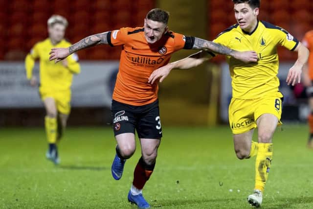 Fraser Aird, left, holds off Falkirk's Ruben Summut during Dundee United's victory over the Bairns at Tannadice. Picture: SNS