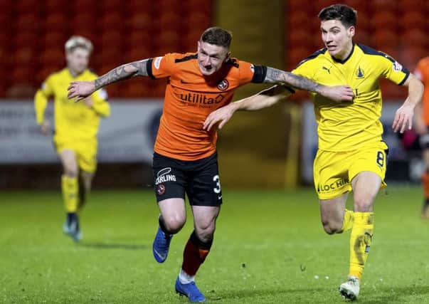 Fraser Aird, left, holds off Falkirk's Ruben Summut during Dundee United's victory over the Bairns at Tannadice. Picture: SNS