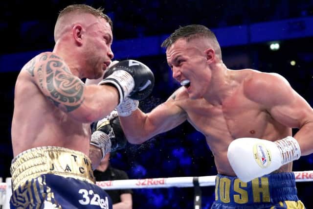 Josh Warrington lands a punch on Carl Frampton during Saturdays title fight.
Picture: Getty