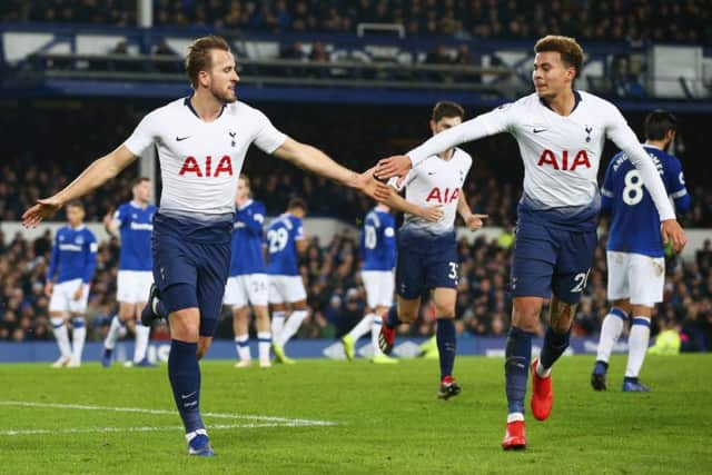 Harry Kane, left, celebrates with team-mate Dele Alli after scoring Tottenham's third goal against Everton. Pictrure: Jan Kruger/Getty