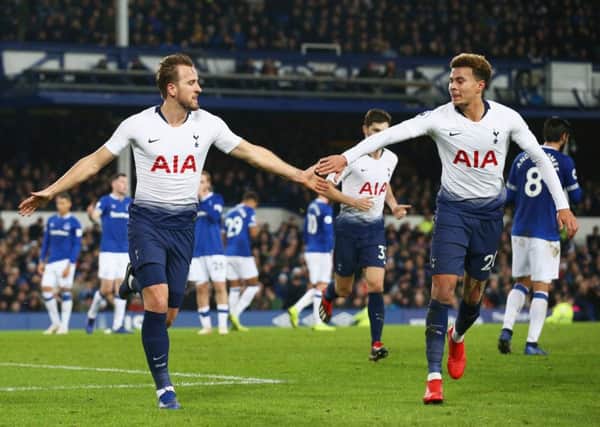 Harry Kane, left, celebrates with team-mate Dele Alli after scoring Tottenham's third goal against Everton. Pictrure: Jan Kruger/Getty