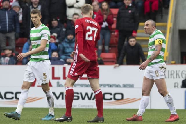 Celtic captain Scott Brown taunts Aberdeen's Sam Cosgrove after he had been sent off. Picture: Craig Foy