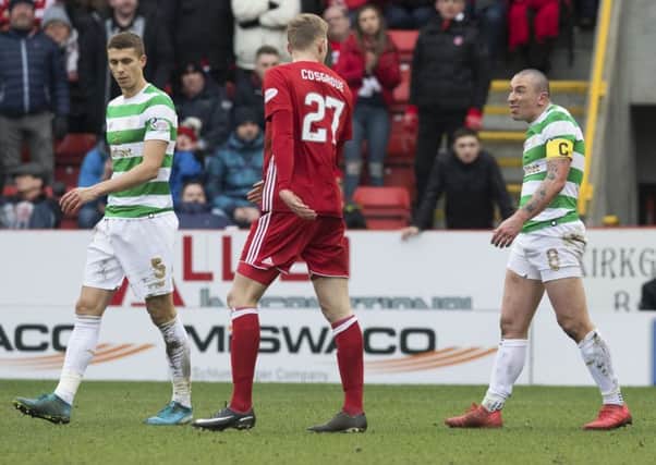 Celtic captain Scott Brown taunts Aberdeen's Sam Cosgrove after he had been sent off. Picture: Craig Foy