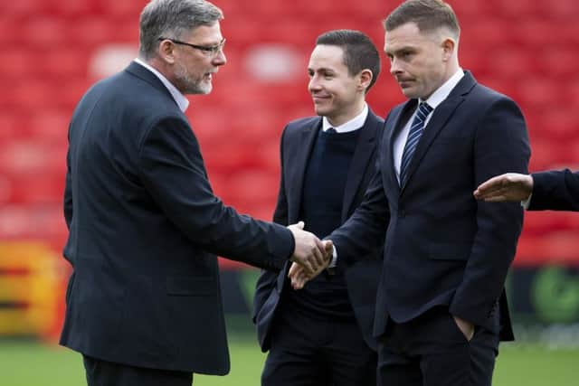 Hearts manager Craig Levein speaks to referee John Beaton ahead of kick off at Pittodrie. Picture: Bruce White/SNS