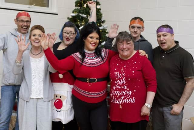 Single mum Taylor Barnes, 21, who dreaded spending Christmas Day alone organised a special dinner for 70 in Greenock. Picture: SWNS