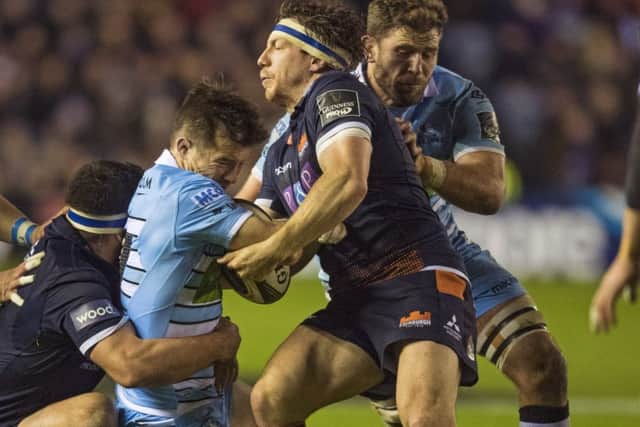 Edinburgh's Hamish Watson tackles Glasgow Warriors' George Horne, left. Picture: Gary Hutchison/SNS