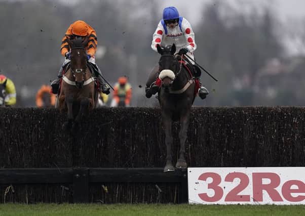 Clan des Obeaux clears the last ahead of Thistlecrack on the to victory in The 32Red King George VI Chase at Kempton. Picture: Alan Crowhurst/Getty