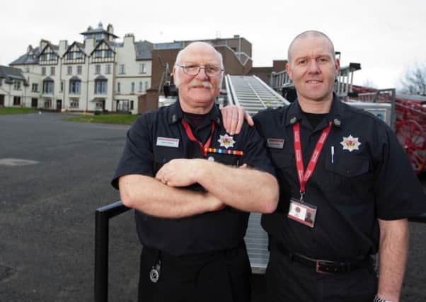 Farries pictured with his son David, who is also in the Scottish Fire and Rescue Service.