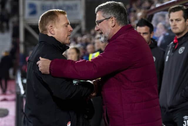 Hibs manager Neil Lennon, left, and Hearts counterpart Craig Levein shake hands ahead of the Edinburgh derby at Tynecastle in October. Picture: SNS.