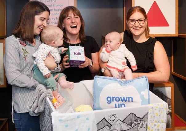Maree Todd (third left), Minister for Children and Young People, with (left to right) Sarah Morrison and daughter Chrissie, Gillian Steele with daughter Erin, marks the first anniversary of the Baby Box initiative at the Museum of Childhood. Picture: Robert Perry/PA Wire