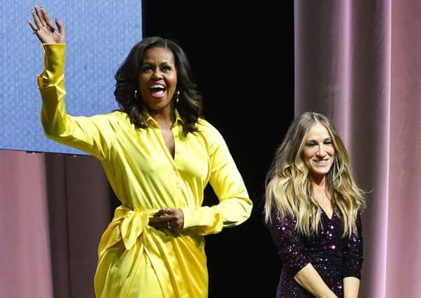 At another of her sell-out book tour events for Becoming, this time talking to Sarah Jessica Parker, she strode on to the stage like an Amazonian goddess, swathed in yellow silk and wearing thigh-length, gold boots. Picture: Getty