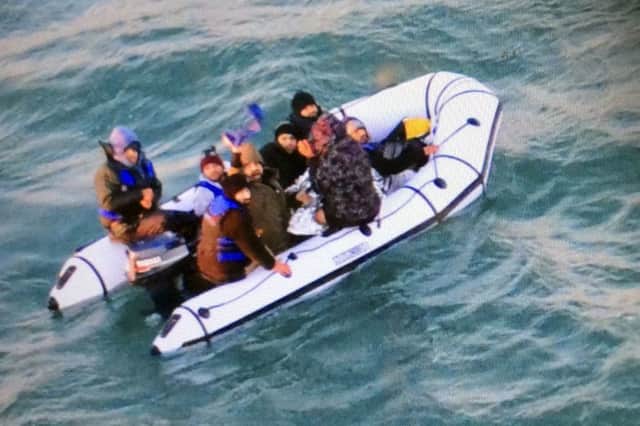 French authorities have rescued eight migrants, including two children, whose engine failed as they tried to sneak across the English Channel to Britain. Picture: Marine Nationale via AP