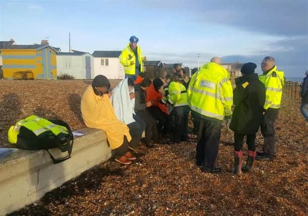 These suspected illegal immigrants were pictured on a beach in Kent on Sunday as the Channel migrant crisis deepened
