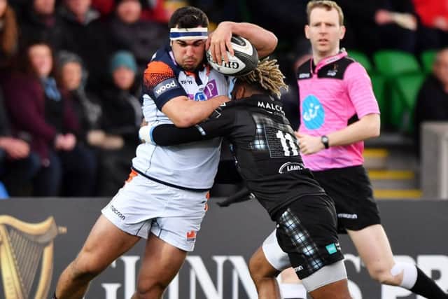 Niko Matawalu tries to stop Edinburgh skipper Stuart McInally. Picture: SNS.