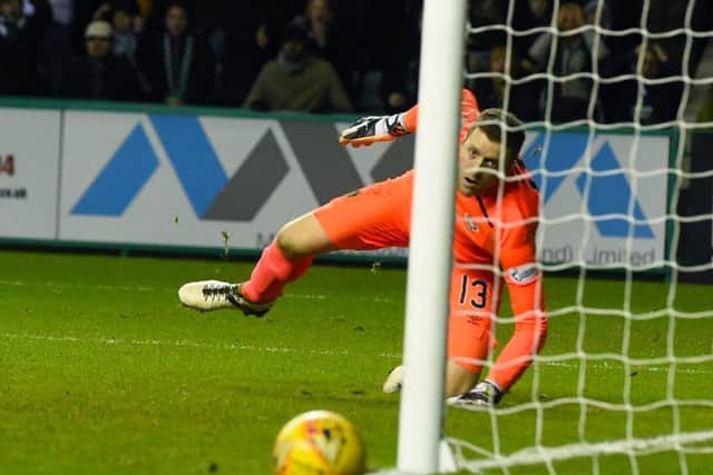 Hearts keeper Colin Doyle watches the ball go out for a corner after he had tipped Steven Whittakers shot on to the inside of a post. Picture: SNS.
