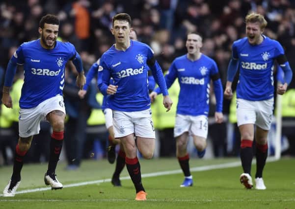 Rangers players run to congratulate Ryan Jack on the goal that decided Saturdays Old Firm clash at Ibrox. Picture: SNS.