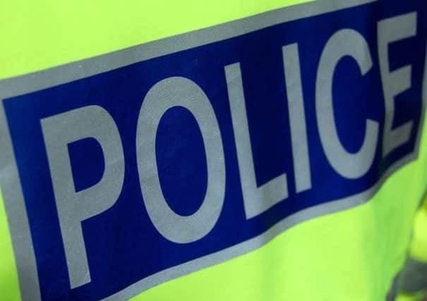 Police were called after a man tried to jump in a car with a woman and child close to a Dundee primary school