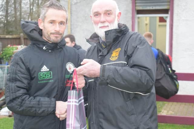 Stewart Maxwell receives a gift from Kilbirnie president Ian MacDonald before Saturdays game.