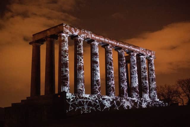 Kapka Kassabova's Love Letter To Europe is projected onto the National Monument of Scotland, Calton Hill, as part of Message From The Skies