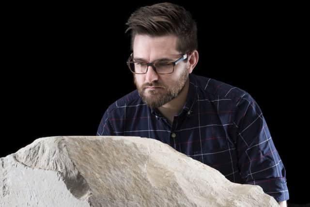 Dr Daniel Potter from the National Museums Scotland with the rare casing stone from the Great Pyramid of Giza. Picture: PA