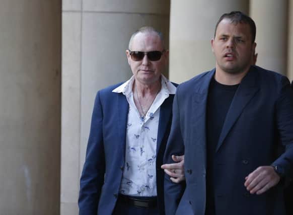 Paul Gascoigne (left) arrives at Teesside Crown Court in Middlesbrough where he is charged with sexually assaulting a woman on a train.
