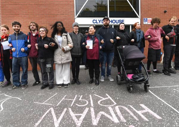 Campaigners form human chain outside Serco in solidarity with asylum seekers. Picture:
John Devlin