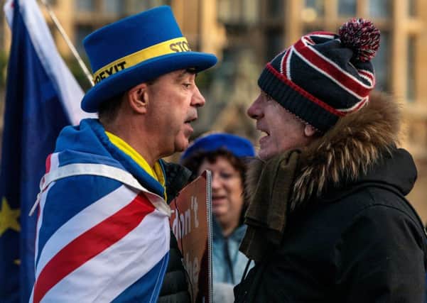 Anti-Brexit protester Steve Bray (left) and a pro-Brexit protester argue as they demonstrate outside the UK Parliament (Picture: Jack Taylor/Getty Images)