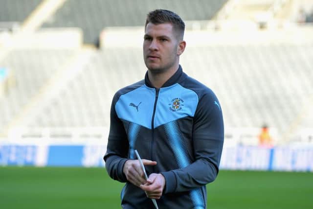 Collins inspects the pitch ahead of an FA Cup tie with Newcastle. Picture: Getty Images