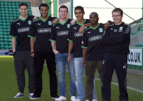 Manager Pat Fenlon, right, along with five of his signings. Picture: SNS