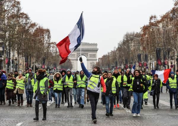 The "Yellow Vests" (Gilets Jaunes) movement in France originally started as a protest about planned fuel hikes but has morphed into a mass protest against President's policies and top-down style of governing. Picture: Valery HACHE / AFP/Getty Images.