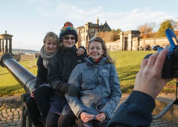 Tourists enjoy the view from Calton Hill, Edinburgh (Picture: Toby Williams)