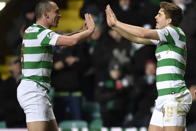 James Forrest, right, says Celtic captain Scott Brown remains an influential member of the squad. Picture: SNS