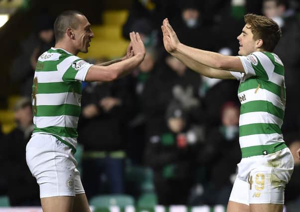 James Forrest, right, says Celtic captain Scott Brown remains an influential member of the squad. Picture: SNS