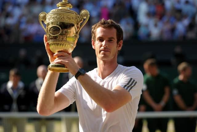 Great Britain's Andy Murray wins his first Wimbledon trophy after beating Serbia's Novak Djokovic in 2013. Picture: Adam Davy/PA Wire
