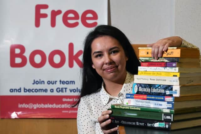 Laura Cesa gets ready for the new free bookshop to be opened in Greenock. Photograph: John Devlin
