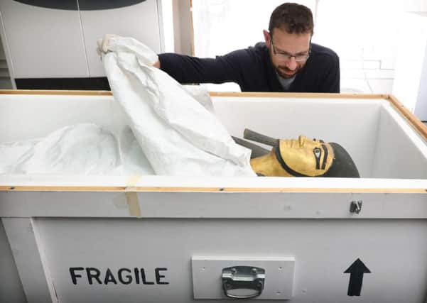 Conservator Charles Stable unpacks the coffin of the estate overseer Khnumhotep. Picture: contributed