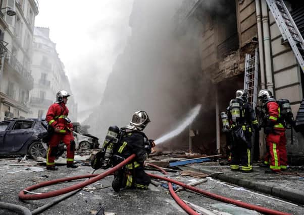 Firefighters extinguish a fire after the explosion of a bakery on the corner of the streets Saint-Cecile and Rue de Trevise in central Paris. Picture: AFP/Getty Images