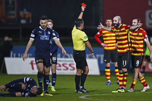 Partick Thistle's Gary Harkins protests his innocence after receiving a red card from referee Andrew Dallas. Picture: Rob Casey/SNS